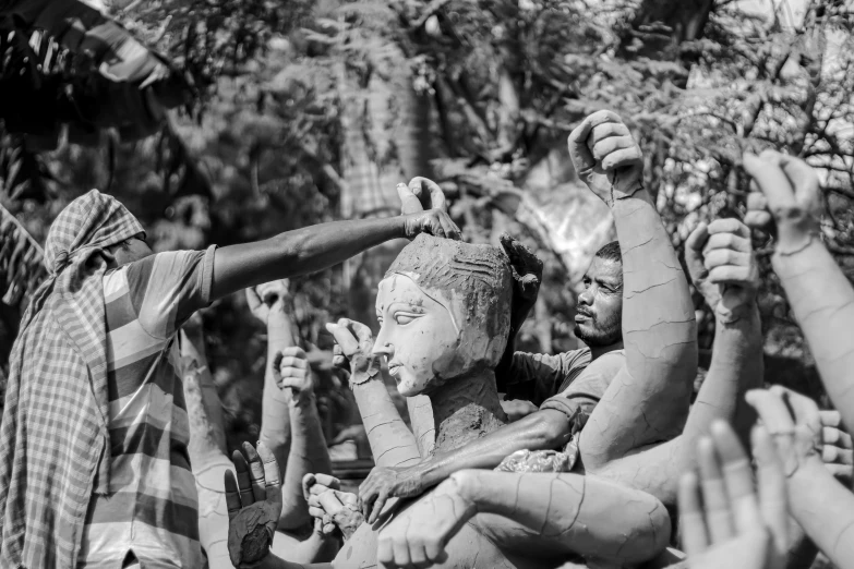 a group of people covered in mud and face paint