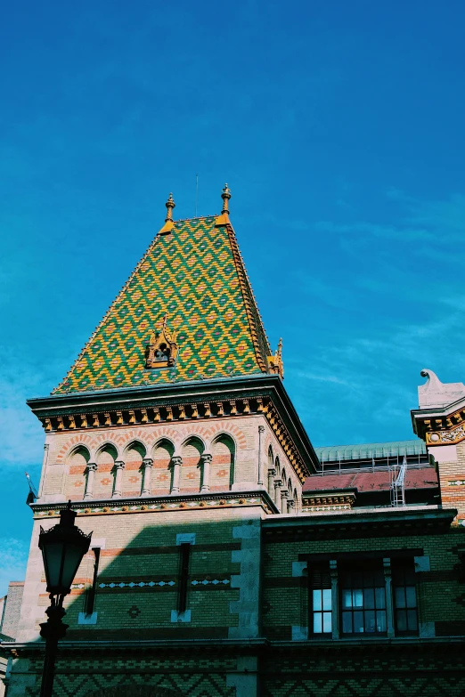 an old building with a triangular roof and a clock