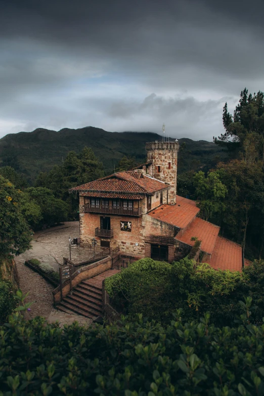 a beautiful, old castle on the side of a hill