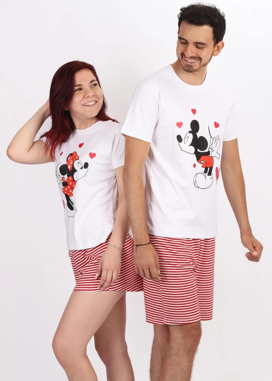 a man and woman dressed in minnie mouse outfits