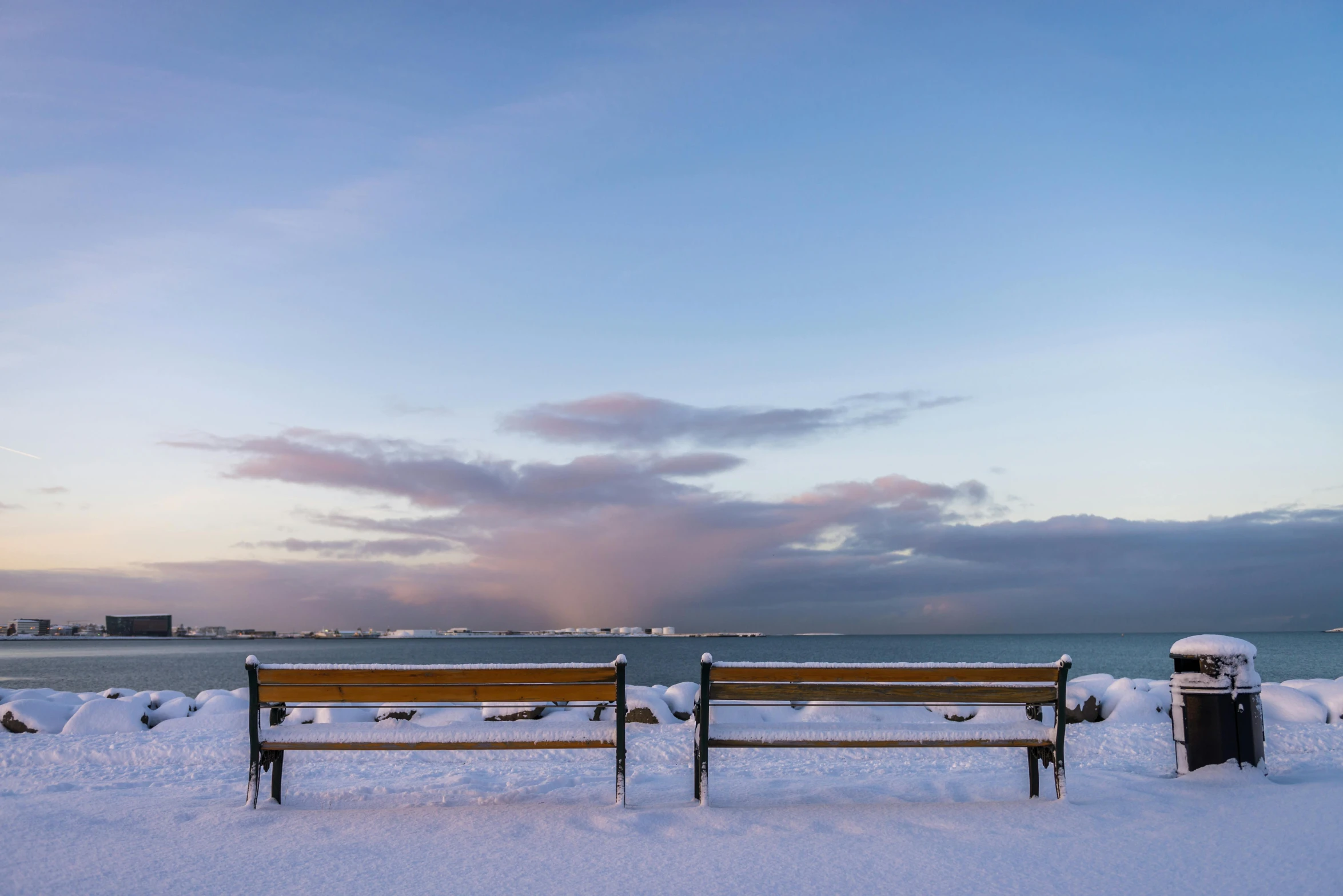 two wooden benches sitting next to each other