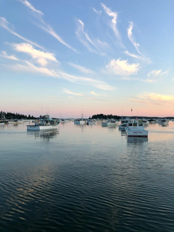 several boats floating on a body of water