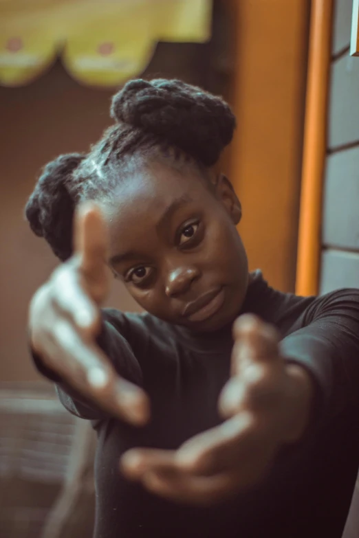 a woman making a hand sign with her fingers