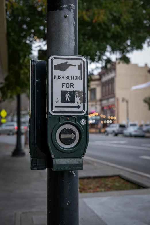 a street sign attached to a pole next to the road