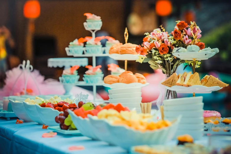 a dessert table with cake, cookies and desserts on it