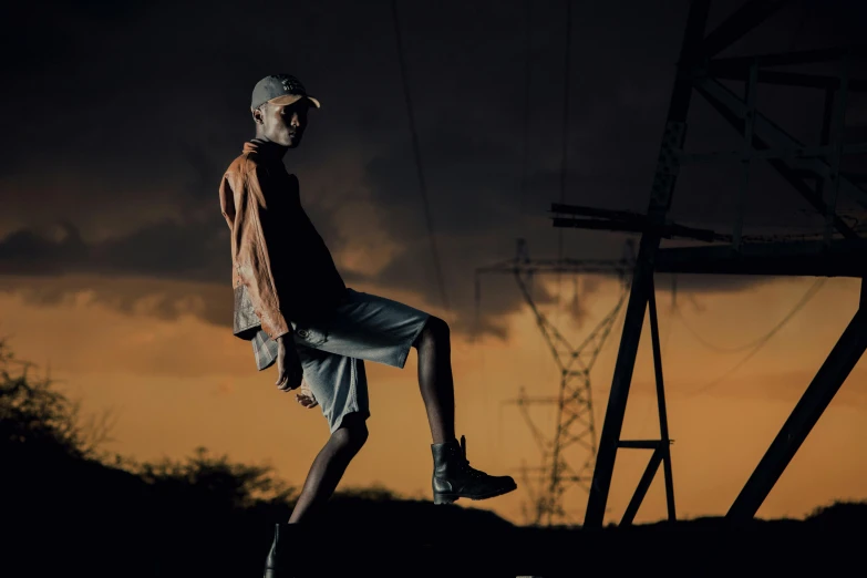 a man standing on a skate board near the sky