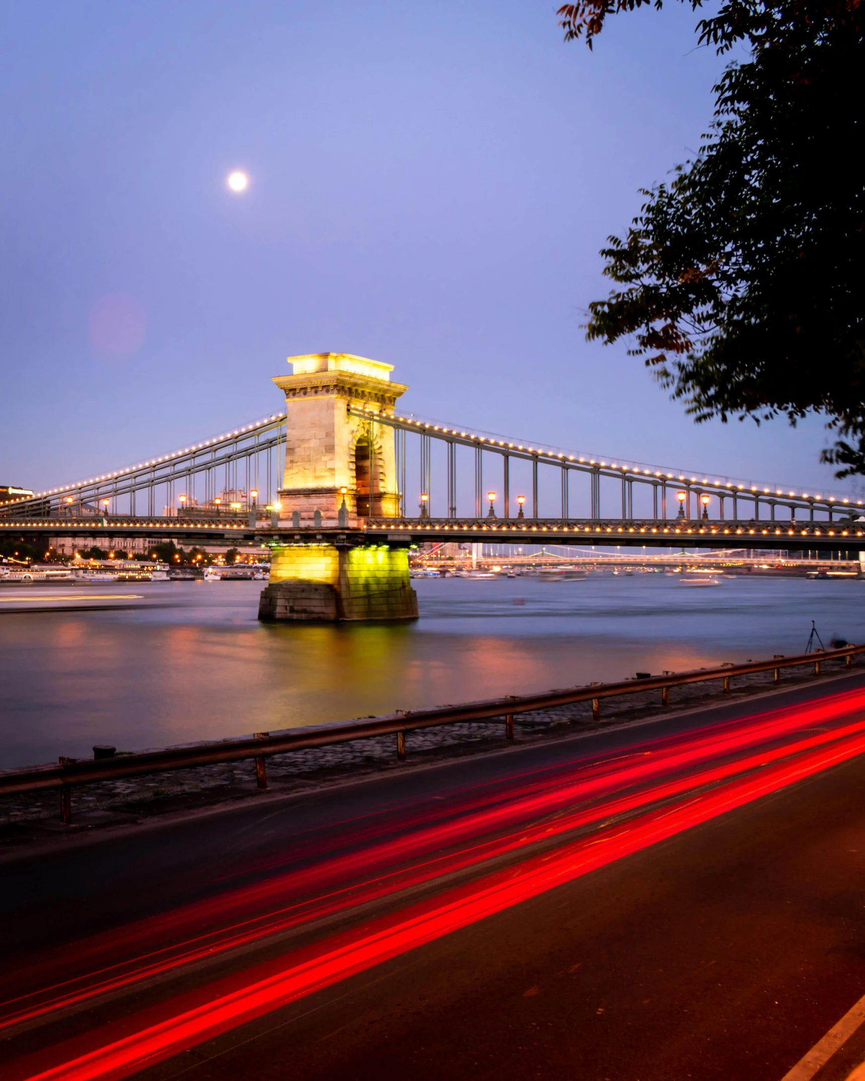 night lights and a large bridge on the water