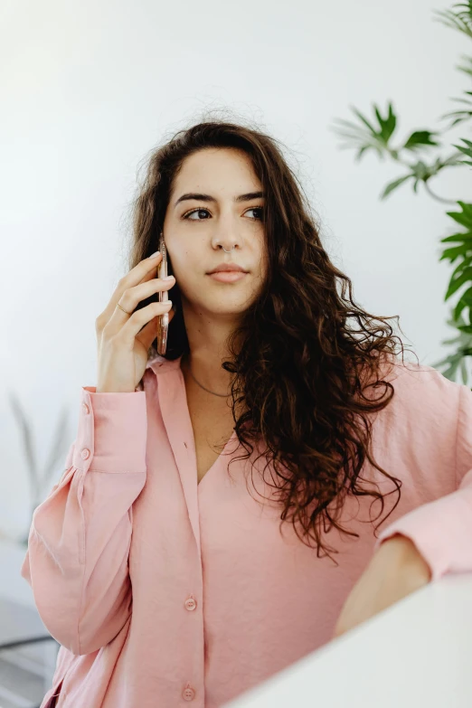 a woman with a cell phone to her ear