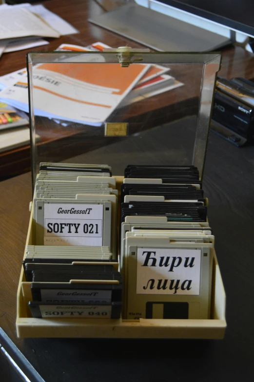 boxes and papers in front of an empty bin