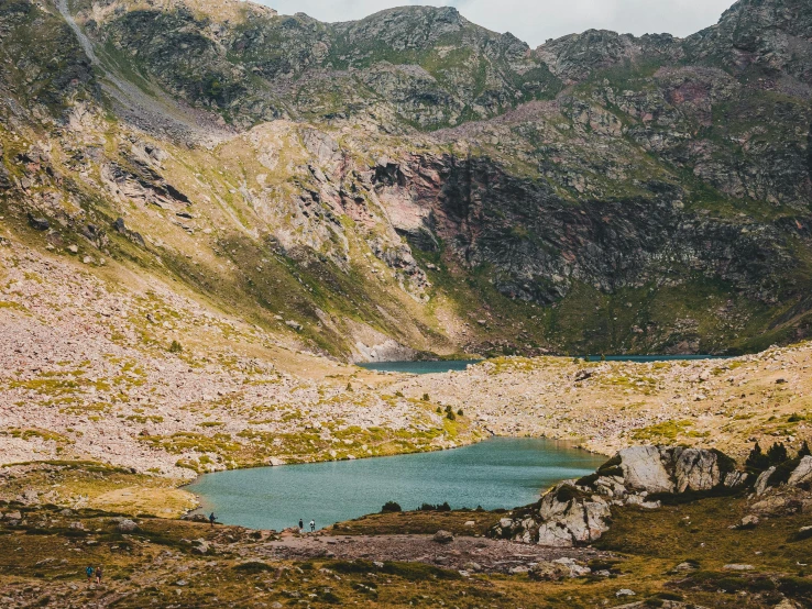 a scenic view of some mountains, lakes and a forest