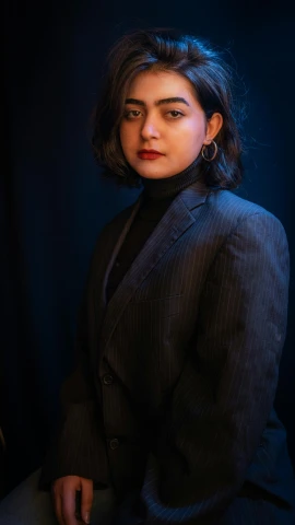 woman in black suit posing for pograph