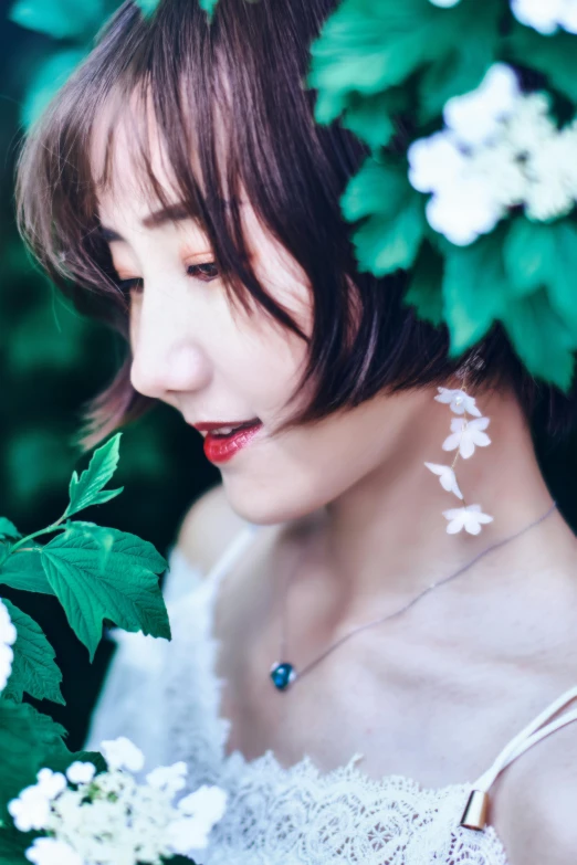 woman wearing white flowers in her hair