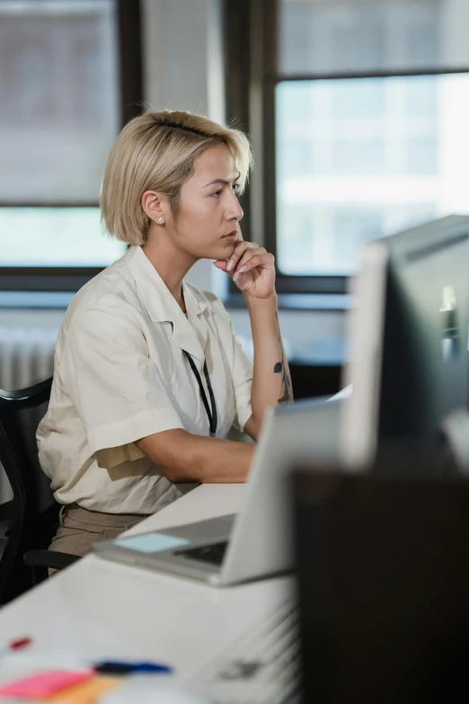 a man sitting in an office looking to his left