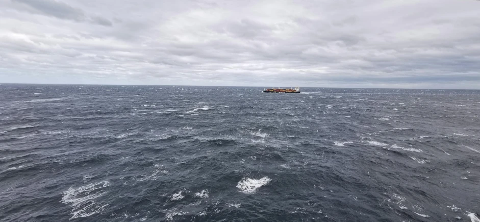 a large body of water with some boats out on it