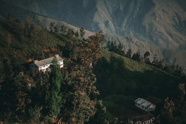 a po taken from above of the house on top of a hill