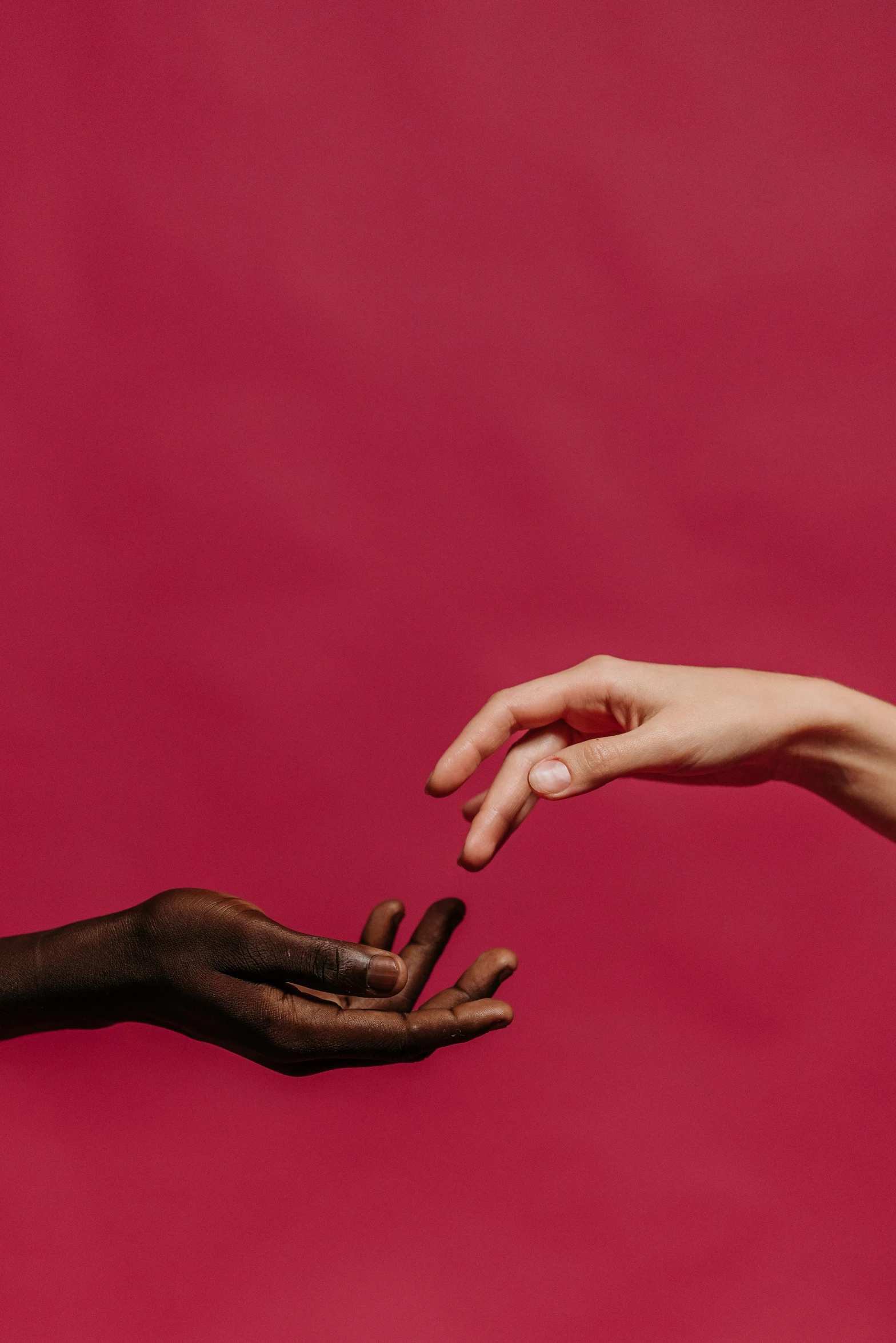 an african american woman reaching out for another person's hand