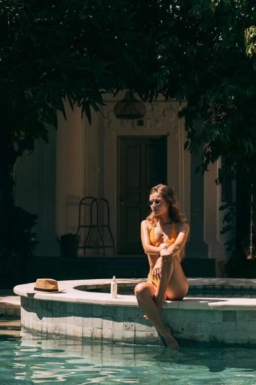 a lady that is sitting down in the water