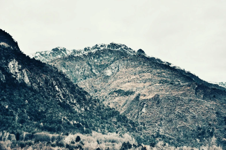 mountains and trees in the background with sky in the background