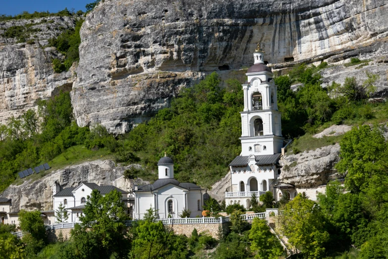 there is a church built on the top of a hill