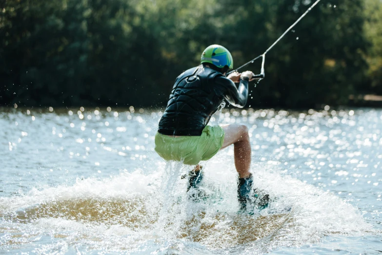 a water skier being towed on water skis by a boat