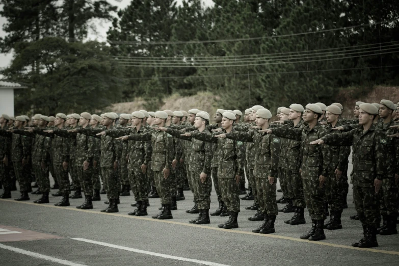 a group of people in uniform standing around each other