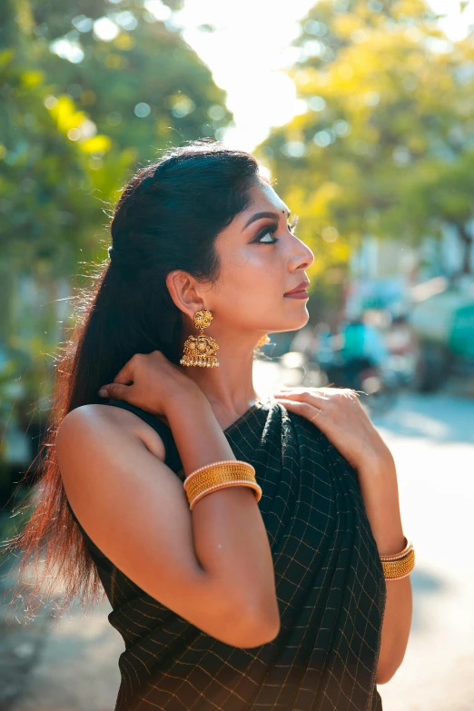 a woman with ear rings on her left ear