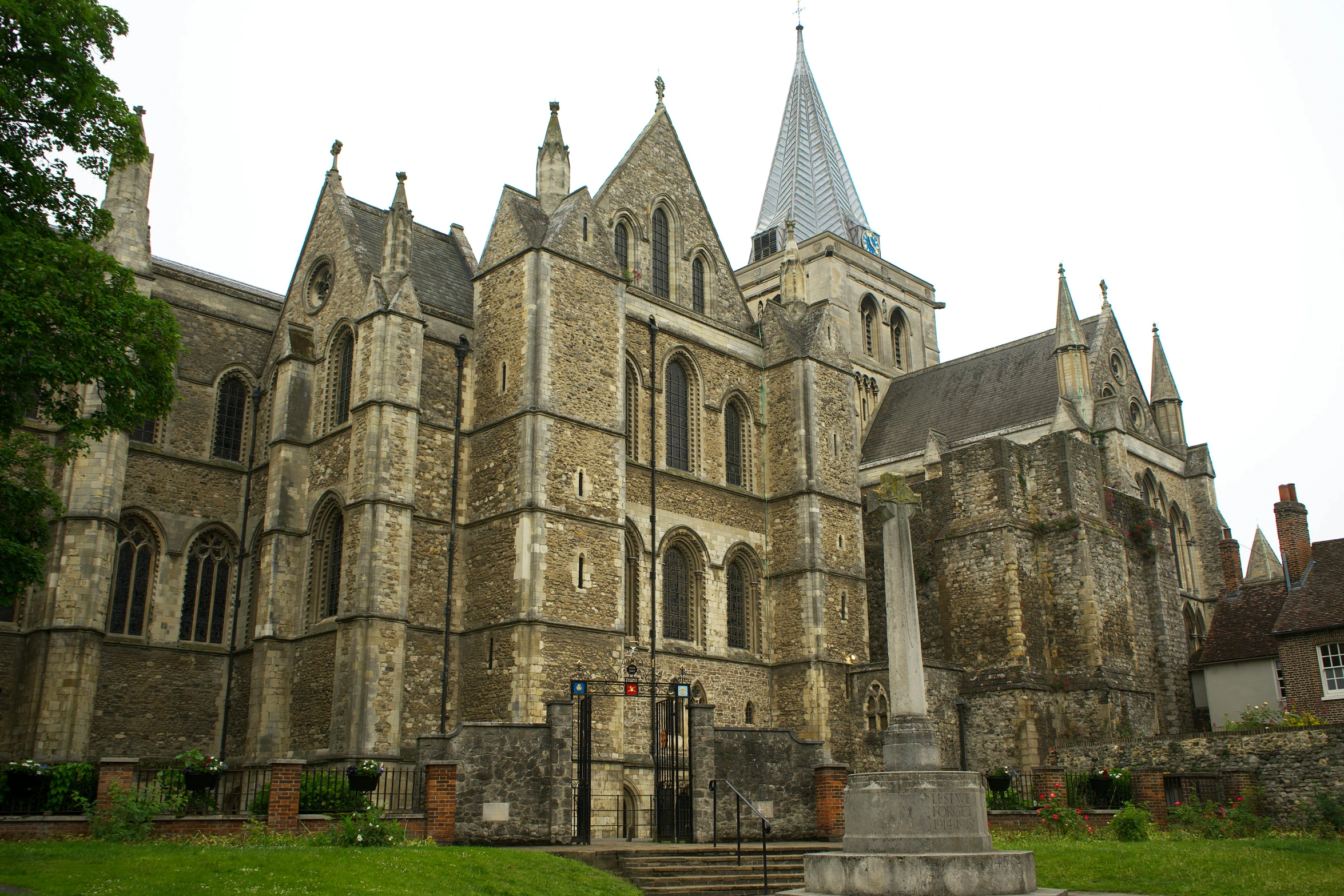 a large castle that has a cross on top of it