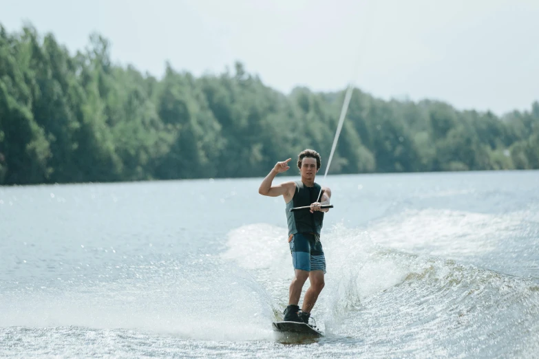 a man that is riding some skis in the water