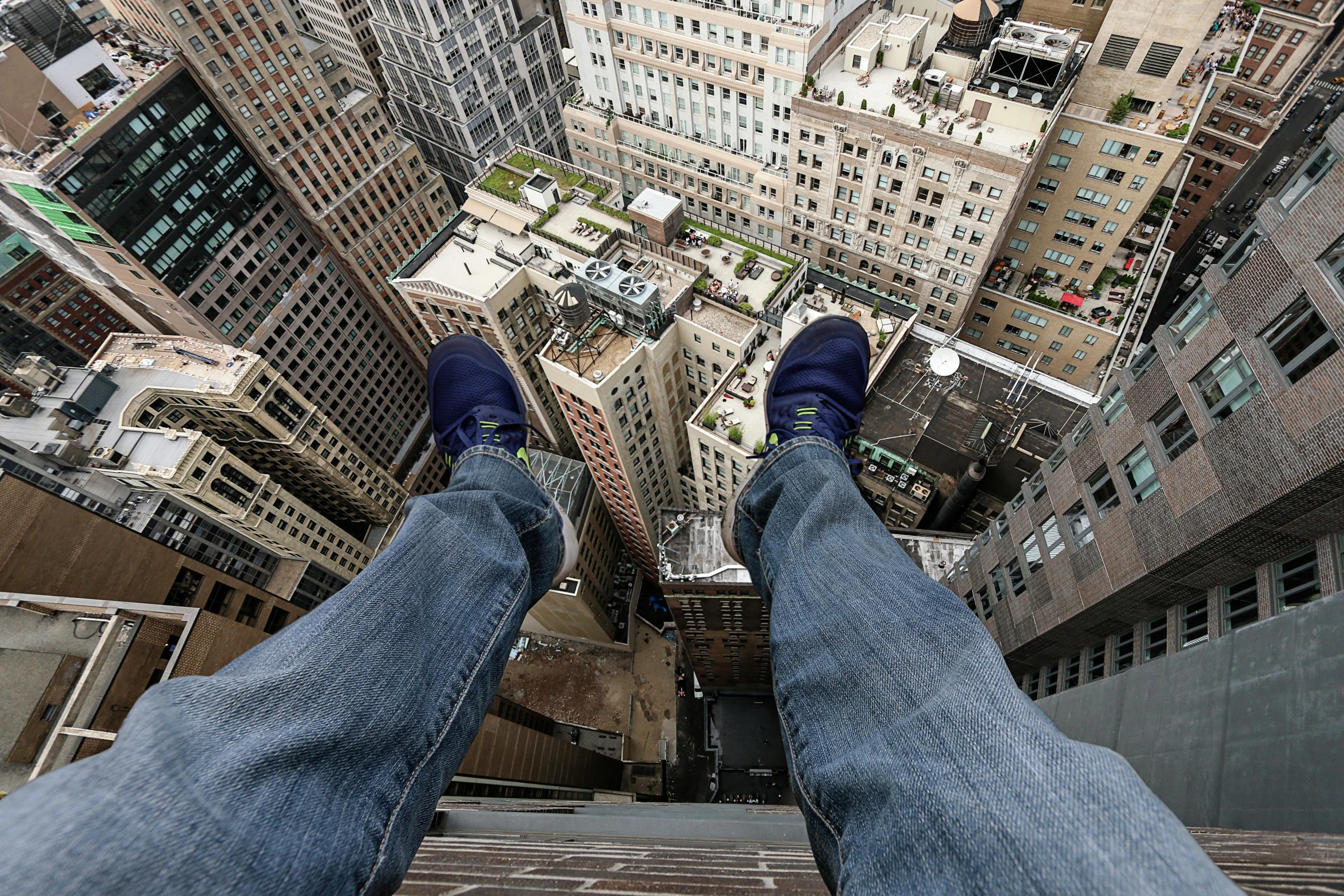 a man standing in the middle of a tall building