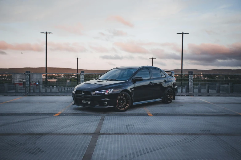 a car is parked in an empty parking lot