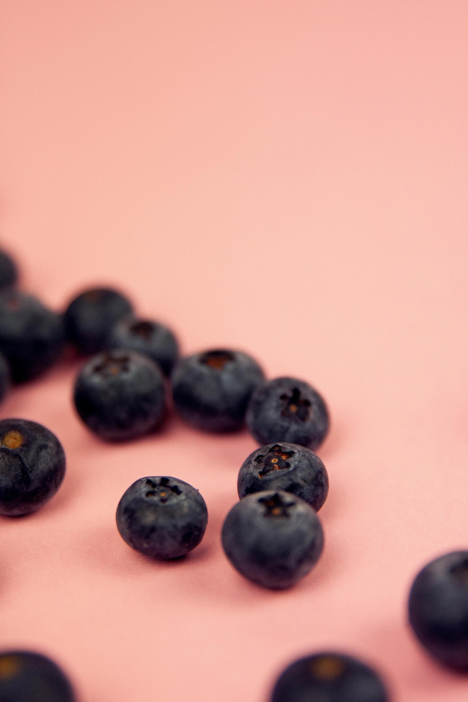 there are many blueberries scattered around and one is missing the middle