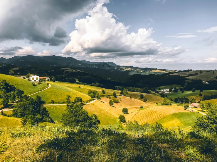 there is a road through some green hills