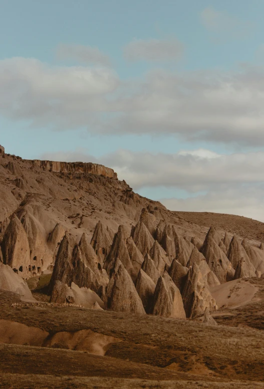 there is a large stone formation on top of the mountain