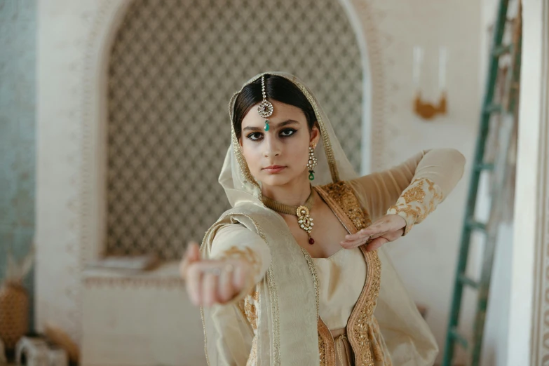 a woman is dressed in a bridal outfit