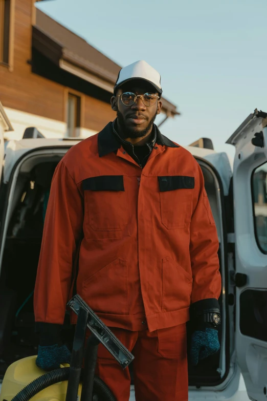 a man with safety gear on next to his truck