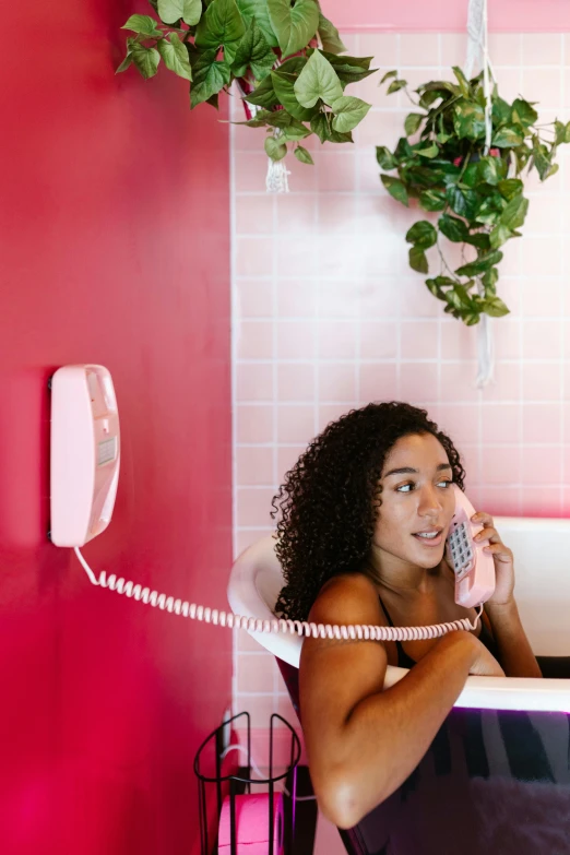 a woman is in the bathroom on her phone