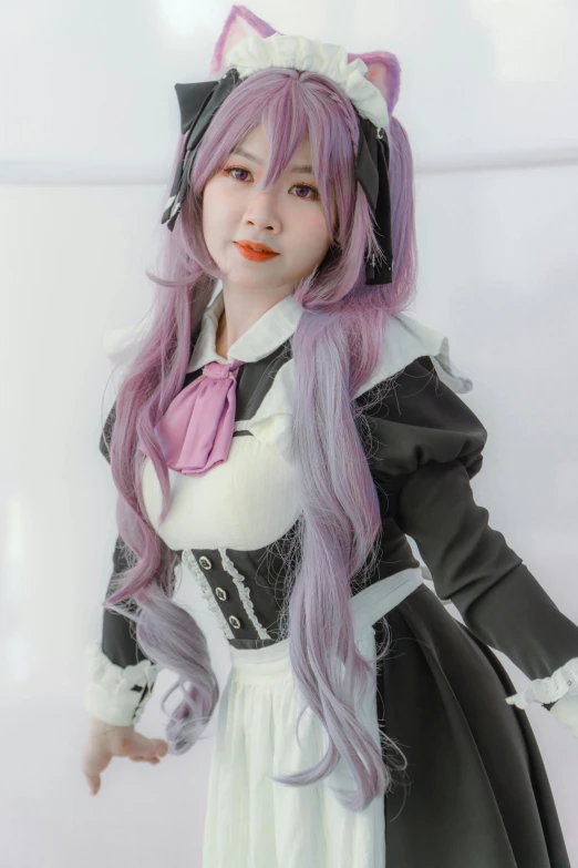 the doll has long purple hair and is wearing a white dress