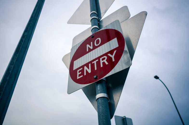 a street sign showing no entry for cars