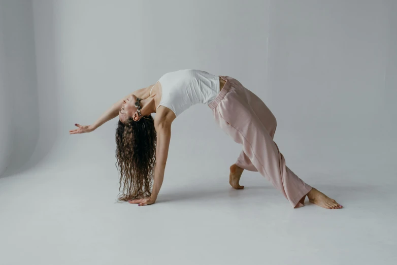 two young ladies in white are doing different poses