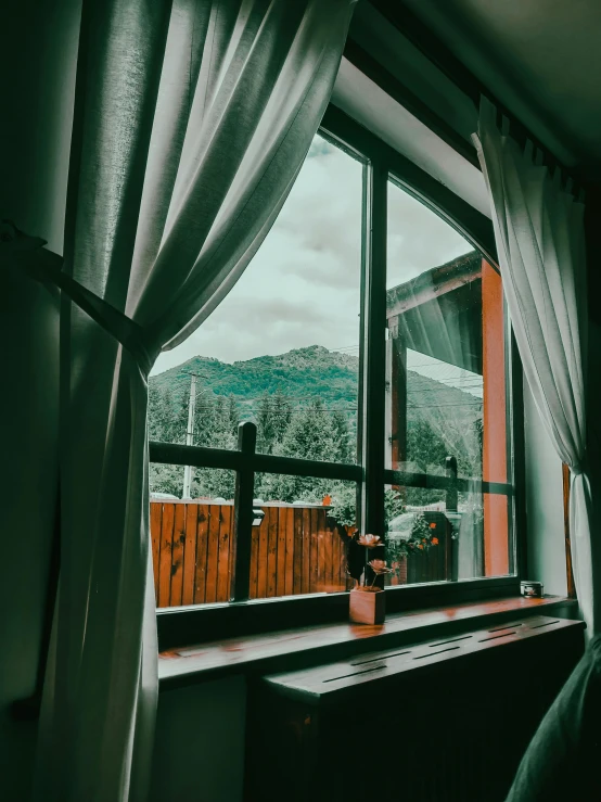 view from a window looking at a mountain