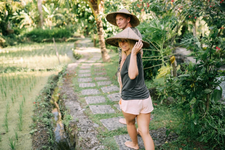 a couple of women walking down a walk way