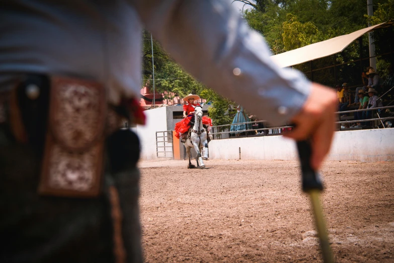 several men in polo uniforms riding horses in an arena