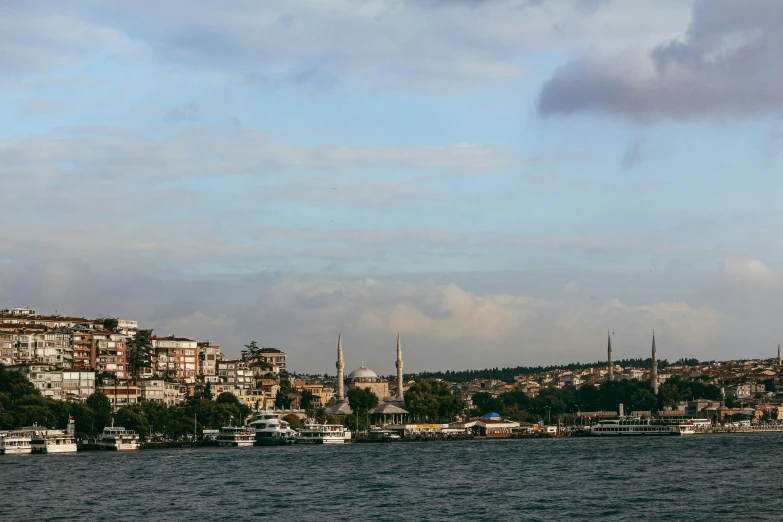 a city skyline, with many buildings along the edge of water