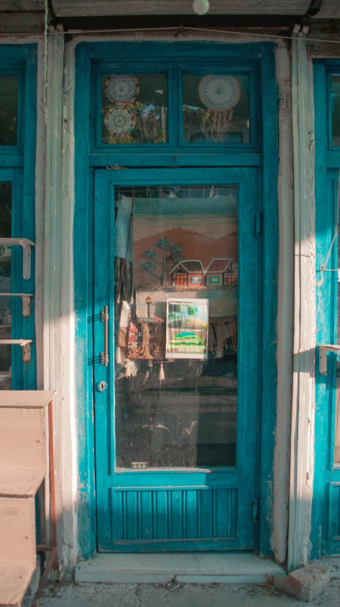 the front of the building has been painted bright turquoise