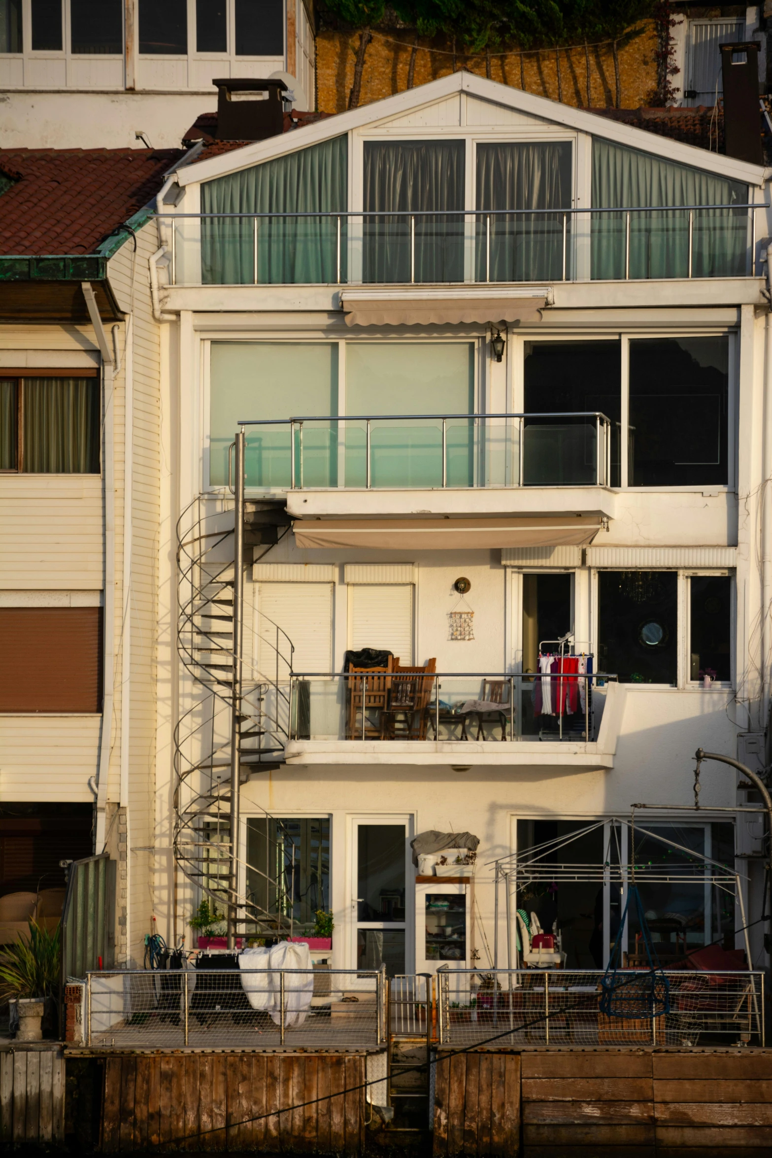 the apartment building has balconies and balconies on it