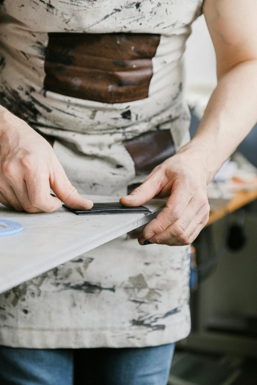 a person using a cell phone to repair soing