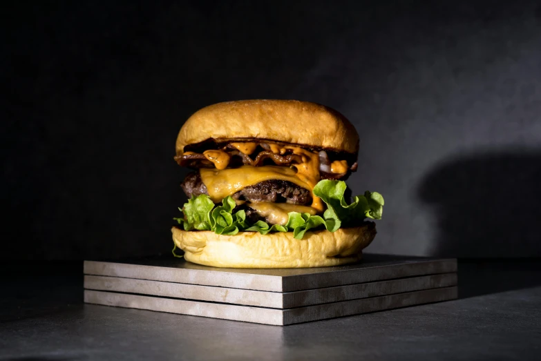 a cheeseburger made out of meat and lettuce