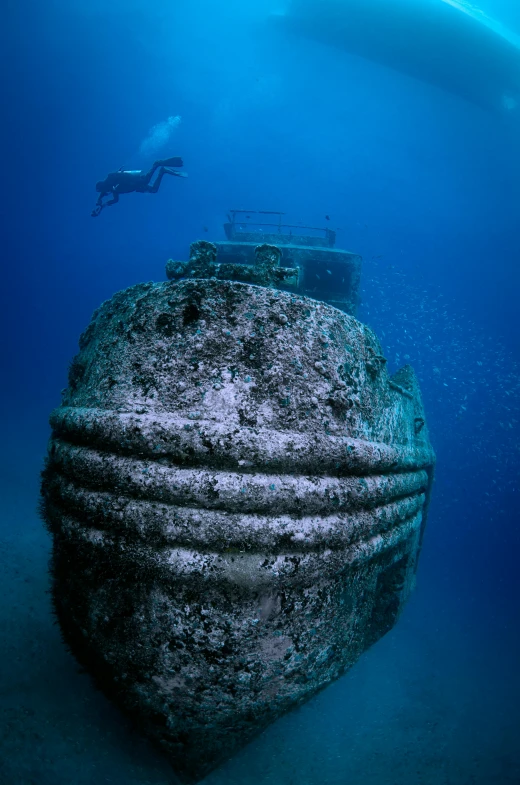 an underwater pograph of a sculpture of a sunken ship