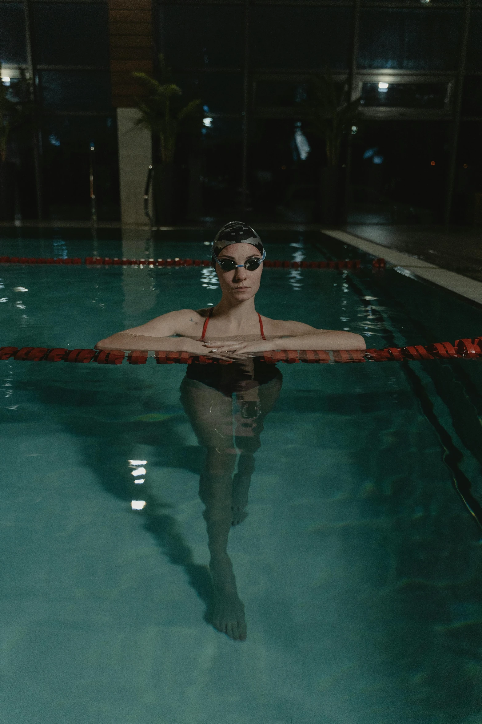 a woman is floating in an empty pool