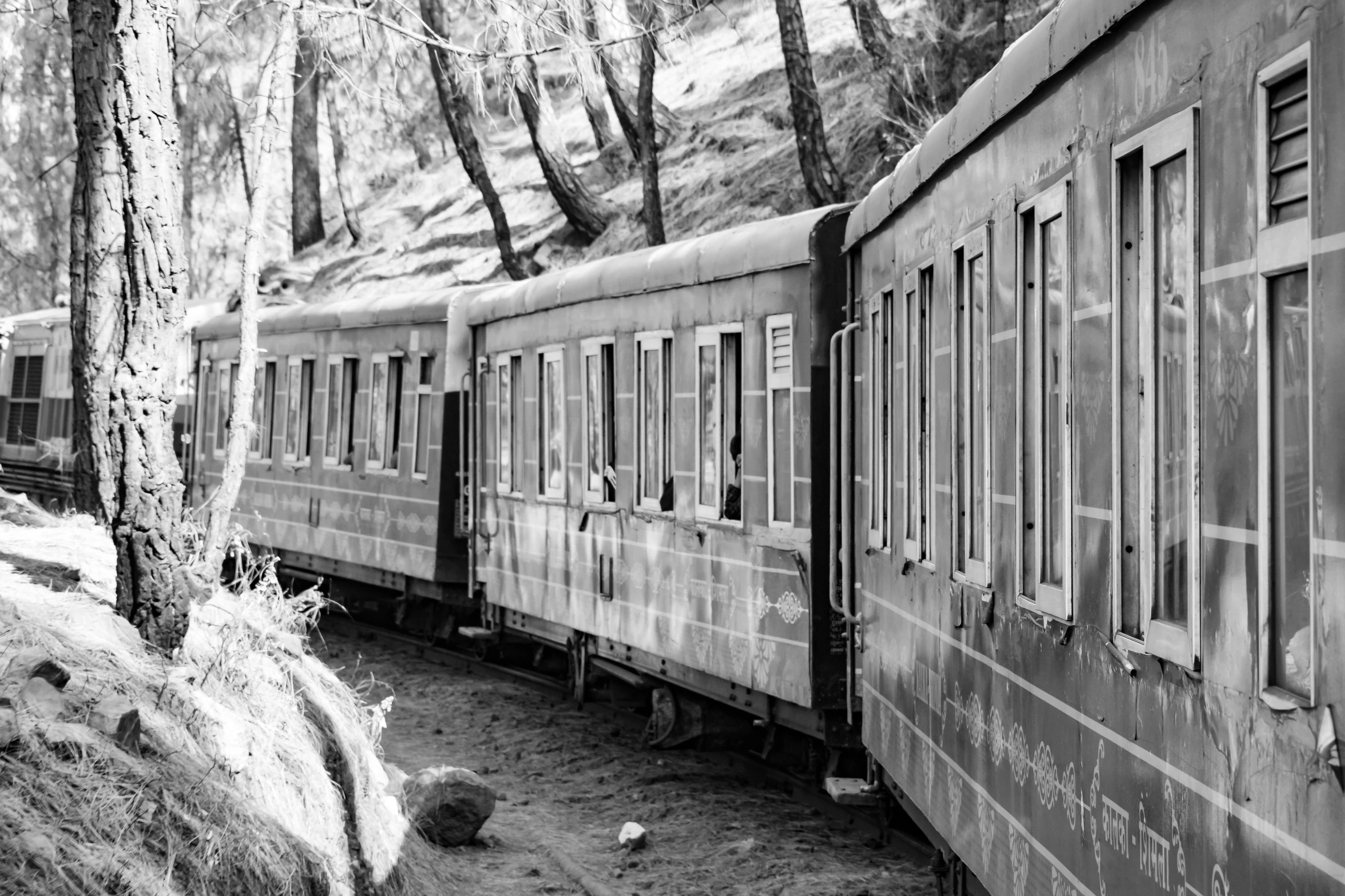 an old abandoned train sitting in the woods